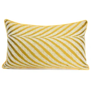Close-up view of the yellow and white chevron pattern and neat piping on the cushion cover.