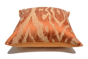 Orange luxury abstract wavy pattern throw pillow cover, elegant sofa cushion detail shot.