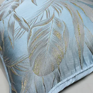 Luxury light blue plant jacquard cushion cover with gold and silver leaf details for home decor.