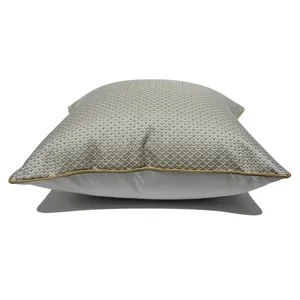 Grey-brown throw pillow with geometric scallop pattern and elegant gold piping for home decor