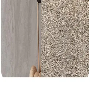 Bathroom storage rack detail close-up showing textured panel and hanging cord accessory.