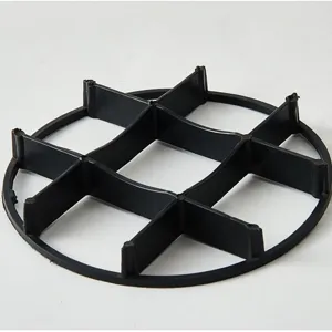 Black plastic flower pot base grid stand for plant root protection and drainage.