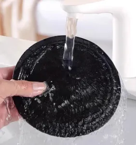 Round exfoliating bath sponge pad for body washing, gentle cleaning shower accessory tool.