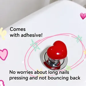 Cute heart toilet flush button extender for long nails, convenient bathroom accessory.