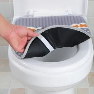 Thick plush toilet seat cover with waterproof backing and velcro strap for warm bathroom use.