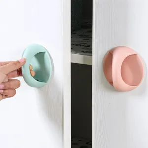 Self-adhesive mini cabinet handle punch-free plastic drawer pull for wardrobe sliding doors.