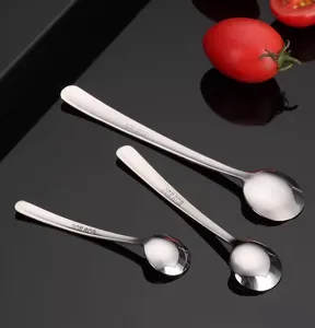 Stainless steel spoon detail, mini coffee stirring spoon and seasoning spoon close up view.
