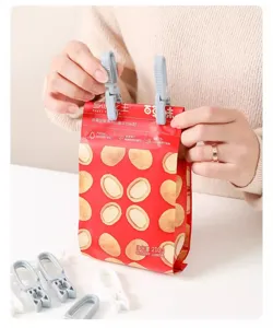 Plastic sealing clip and clothes pin detail shot, durable household accessory for bags.