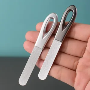 Stainless steel double sided nail files with metal handle and fine abrasive grinding surface.