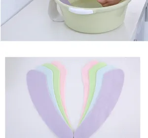 Detailed view of waterproof adhesive toilet seat covers in various pastel colors for home use.