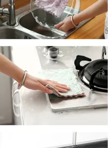 Coral fleece kitchen cleaning cloth detail showing superior water absorption for dishes.