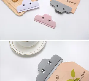 Detailed view of colorful cloud-shaped plastic bag sealing clips used for food storage in kitchen.