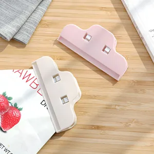 Plastic food sealing clip for snack bags, cloud shape kitchen moisture-proof freshness tool.