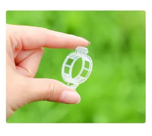 Transparent plastic plant clips for garden vines support, durable and practical clamps.