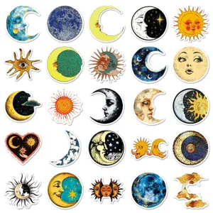 Detailed view of vintage celestial stickers featuring sun, moon, and star art designs.
