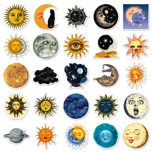Detail shot of vintage celestial stickers featuring sun, moon, and stars illustrations.