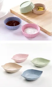 Detail view of wheat straw sauce dishes, small leaf and round bowls for condiments, multi-color.