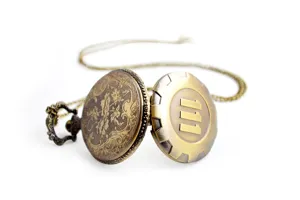 Close-up of vintage bronze quartz pocket watch with intricate floral engraving and number 111