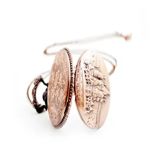 Vintage bronze pocket watch with exquisite castle relief engraving and matching chain necklace.