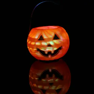 Halloween glowing pumpkin bucket candy container portable jack-o'-lantern party decor prop.