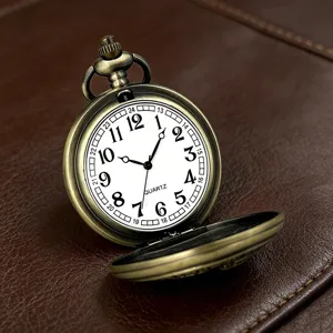 Vintage bronze quartz pocket watch dial detail showing clear arabic numerals and classic design.