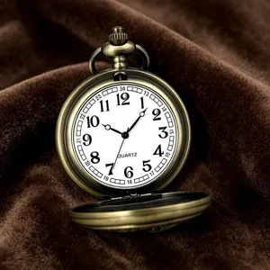 Vintage bronze quartz pocket watch detail view, classic Arabic numerals and dial design.