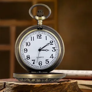 Vintage bronze pocket watch with white dial and quartz movement, retro classic timepiece.