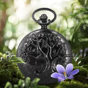 Vintage black pocket watch featuring a detailed tree of life embossed design and quartz movement.