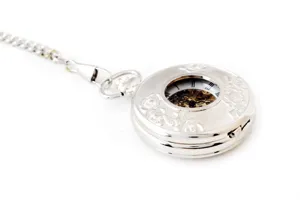 Silver vintage skeleton mechanical pocket watch with chain and floral relief design.