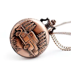 Vintage bronze pocket watch with embossed truck and pine tree design, includes matching chain.