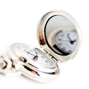 Detailed close-up of a vintage silver pocket watch with chain, white dial and inner lid mirror.