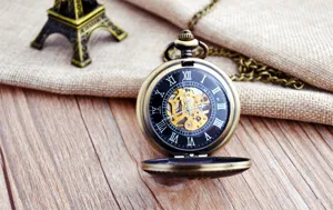 Vintage bronze mechanical pocket watch with Roman numerals and chain for unisex fashion styling.