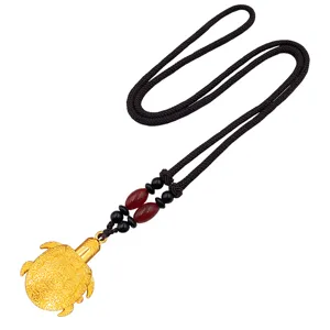 Detailed view of the retro gold turtle pendant necklace with black cord and elegant decorative beads.