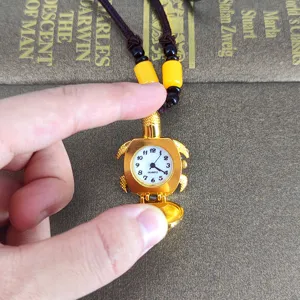 Cute vintage golden turtle pocket watch necklace, quartz watch pendant detail display.