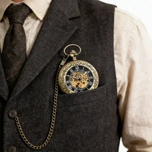 Vintage skeleton mechanical pocket watch featuring bronze carved case and attached chain.