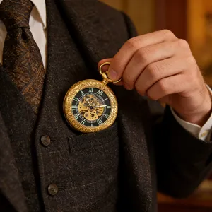 Vintage mechanical pocket watch with carved gold case, skeleton dial and classic Roman numerals.