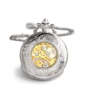 Vintage silver mechanical pocket watch with carved case, transparent skeleton dial and chain.
