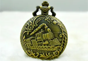 Detailed view of the vintage bronze pocket watch with steam locomotive relief design.