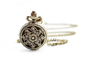 Vintage bronze hollow flower pocket watch with long chain, detailed close-up view.