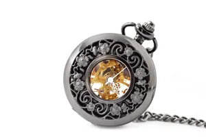 Exquisite vintage mechanical pocket watch with hollow floral carved design and visible skeleton gears.