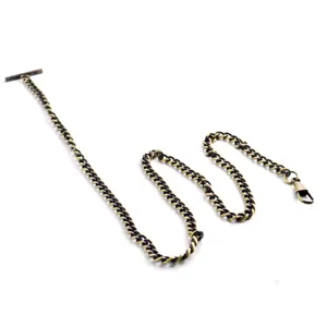 Close-up detail of vintage bronze pocket watch chain, metallic T-bar and clasp accessory.