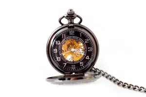 Vintage skeleton mechanical pocket watch with metallic chain for classic daily wear.