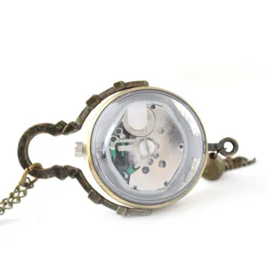 Vintage bronze quartz pocket watch with clear spherical glass cover and metal chain.