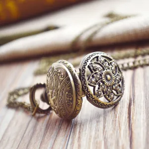 Vintage bronze hollow floral pocket watch with matching chain for daily wear main image.