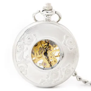 Silver mechanical pocket watch with hollow floral carving and visible vintage golden gear dial.