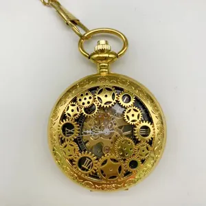 Gold skeleton mechanical pocket watch detail showing intricate gear design and Roman numerals.