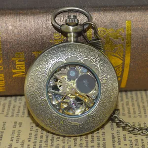 Vintage mechanical pocket watch with hollow gear design and retro bronze finish chain accessory.