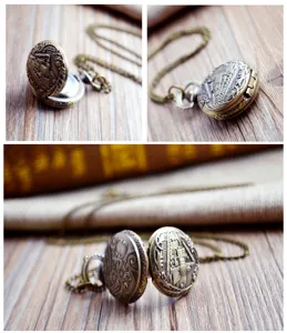 Vintage bronze quartz pocket watch with delicate train engraving and chain necklace accessory.