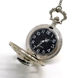 Vintage silver pocket watch with starry black dial, quartz movement and compass design.
