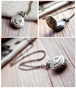 Vintage bronze quartz pocket watch with playing card royal flush design and long chain.